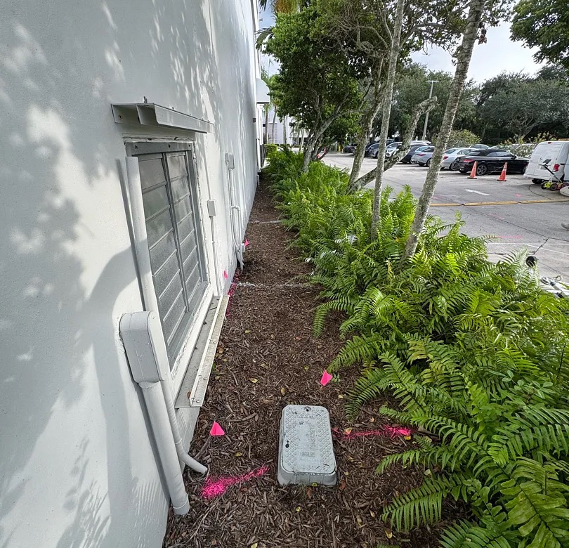 Water service line traced from a riser to its valve box on a Florida residential property