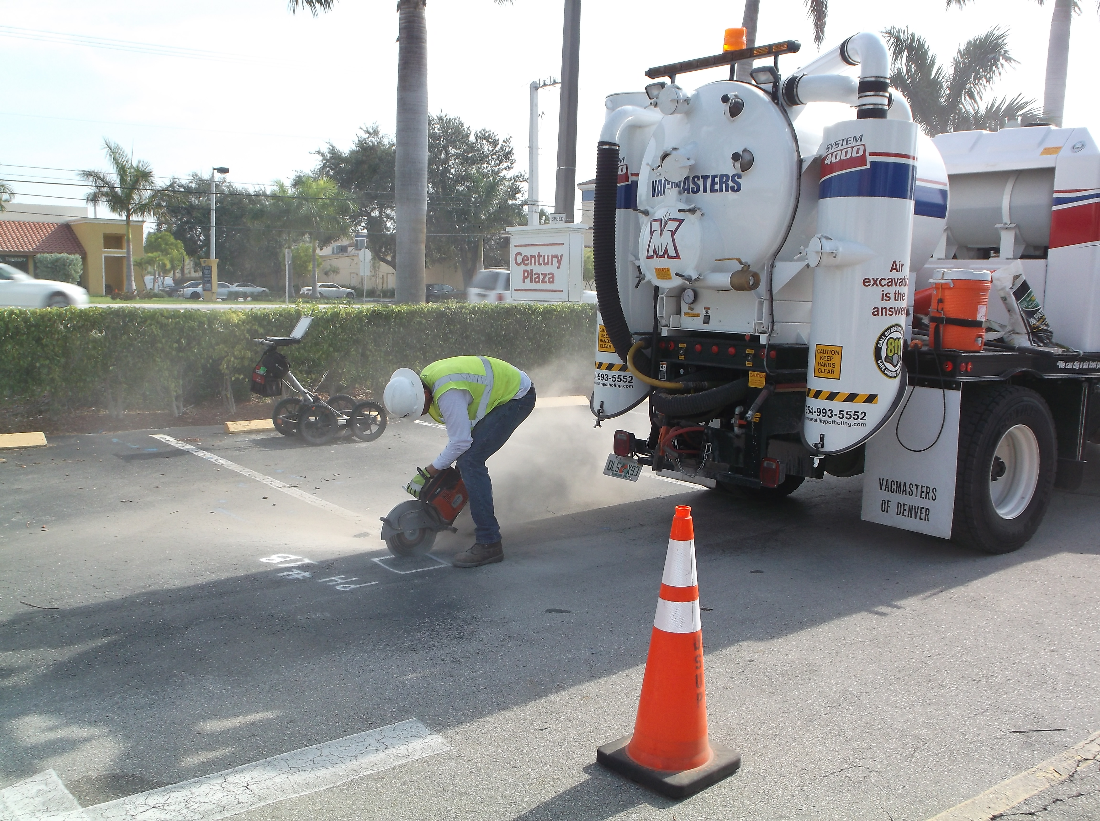 US Utility Potholing crew sawcutting asphalt utility pothole South Florida